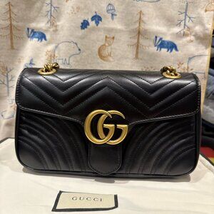 BlackGucci GG Marmont quilted black leather flap bag Gucci Marmont flap bag